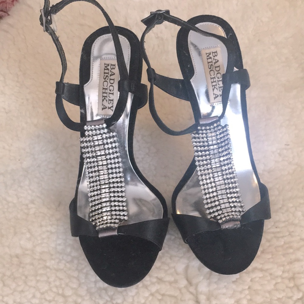 Black velvet with T strap stiletto sandals with leather sole.